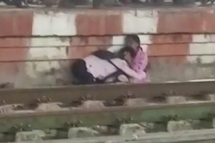 Mother-son duo have narrow escape while crossing railway track